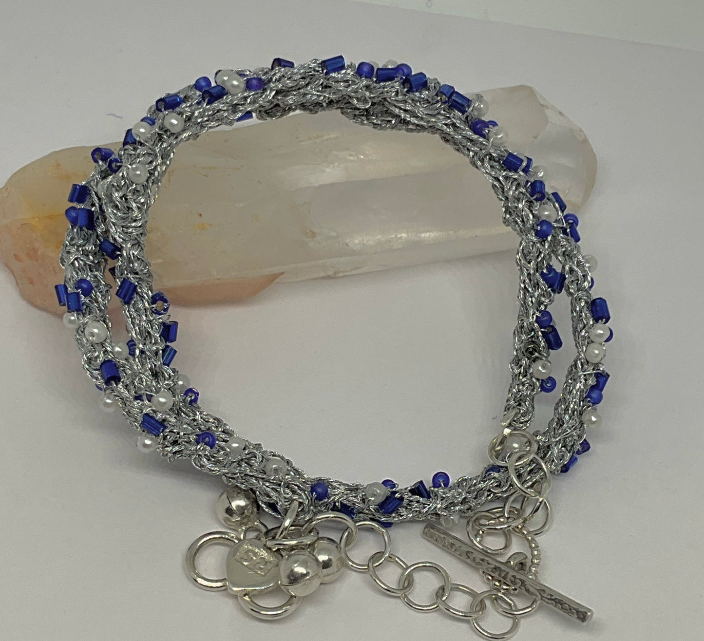 Bracelet woven in silver thread.