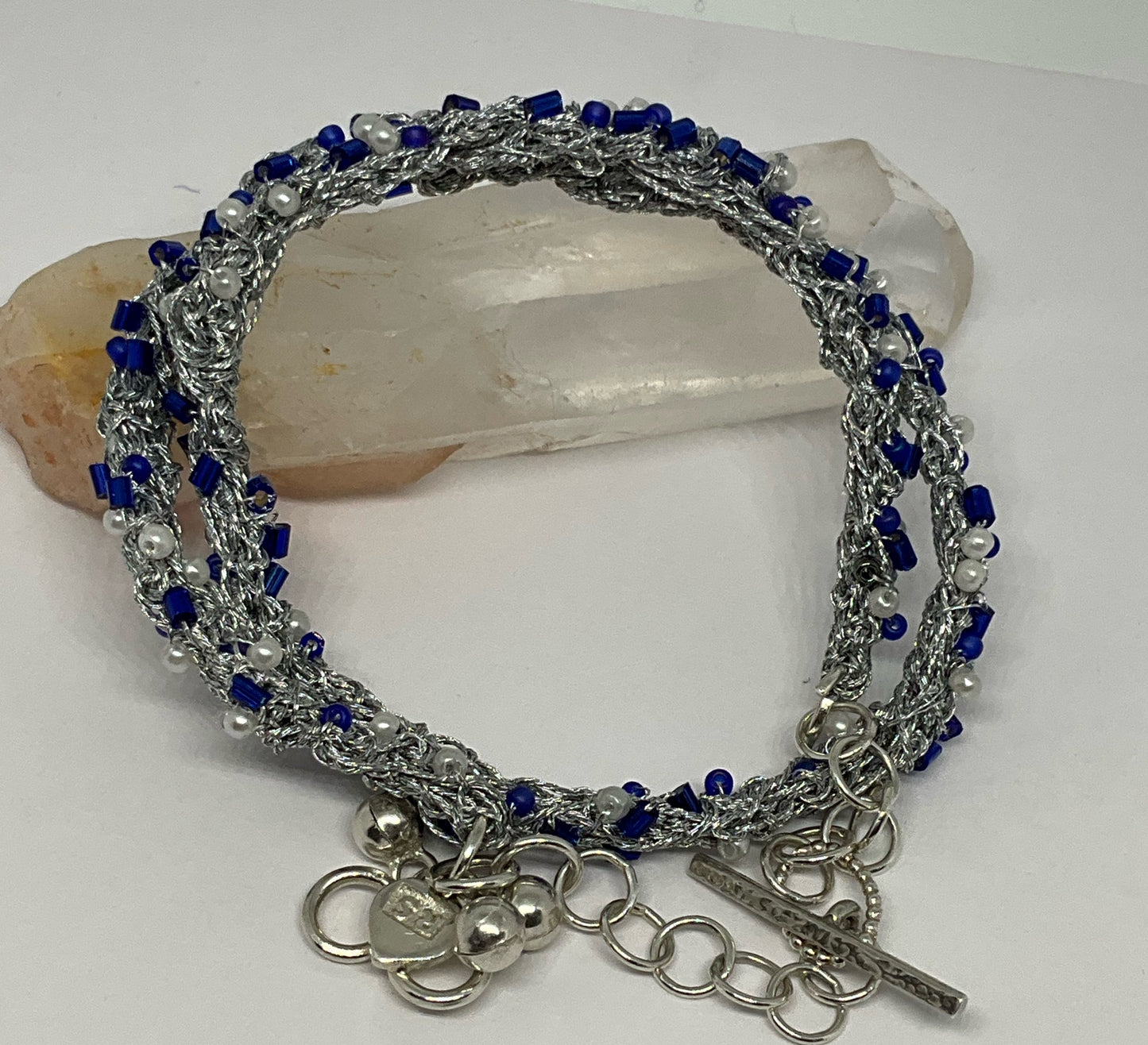 Bracelet woven in silver thread.