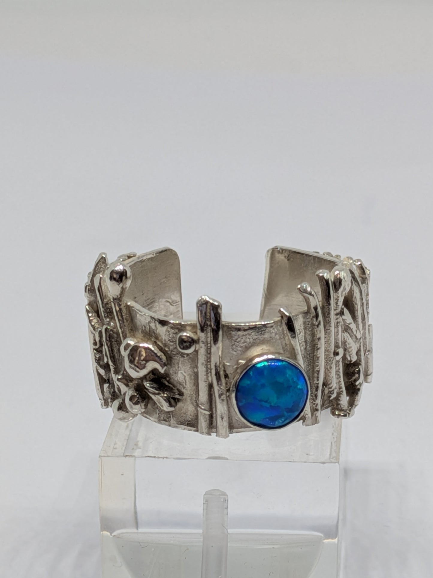 Electric Blue Opal set in Botanical Inspired Silver Ring.