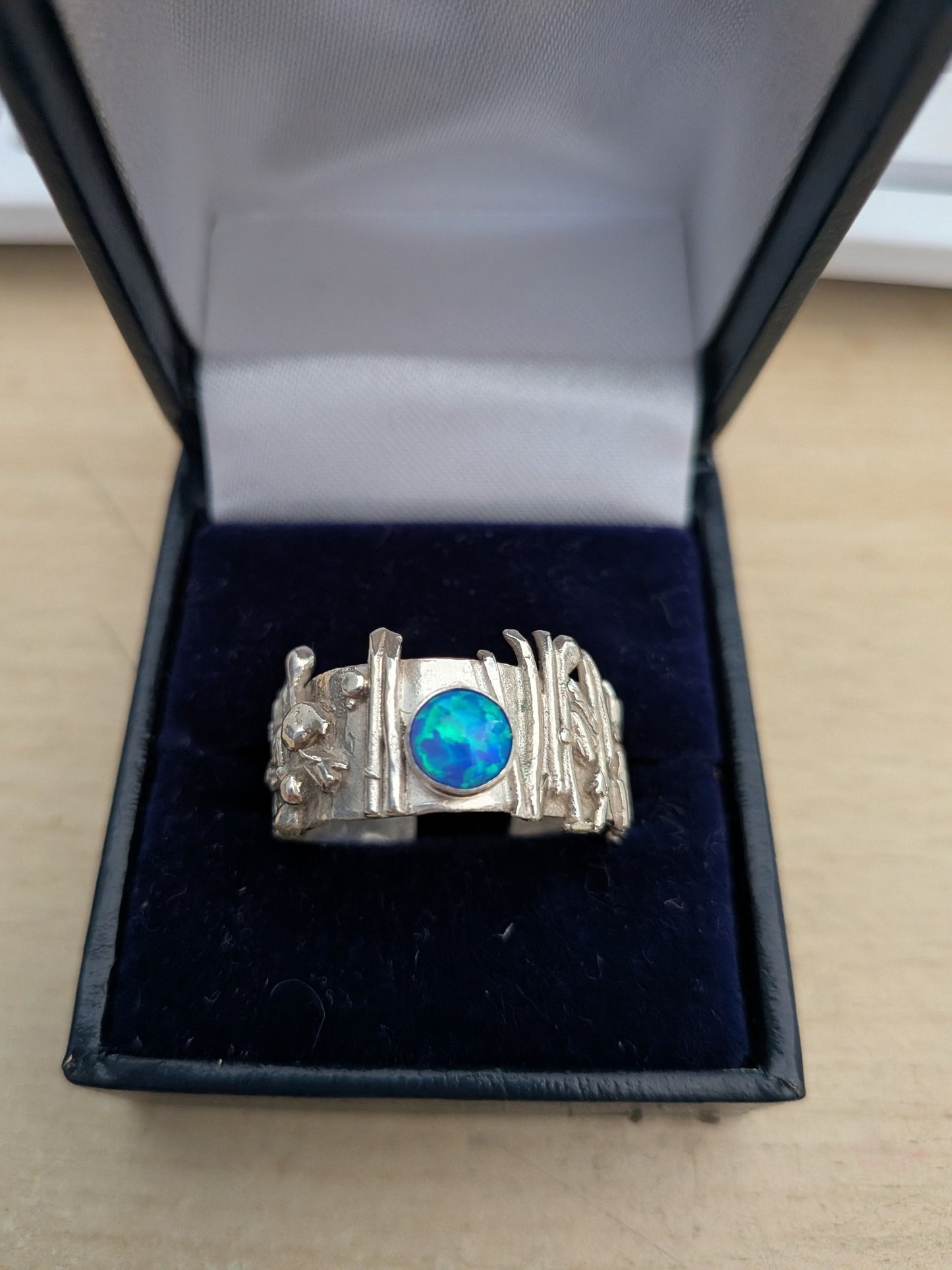 Electric Blue Opal set in Botanical Inspired Silver Ring.